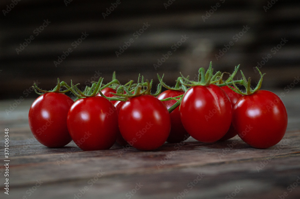 Fresh tasty juicy tomatoes on grey background, closeup vegetables Fresh tasty juicy tomatoes on grey background, closeup vegetables