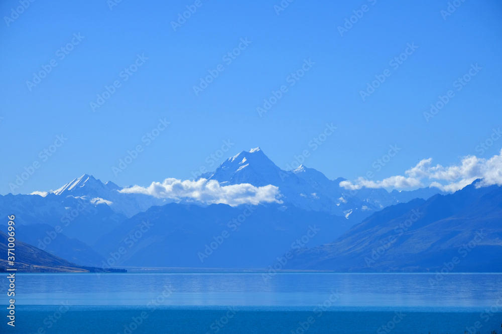 Mountain lake clouds and view of New Zealand in spring season