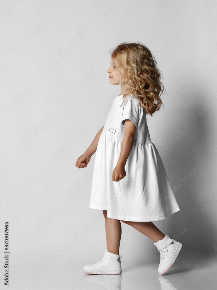Portrait Casual Woman in White Dress and Sneakers Stock Image