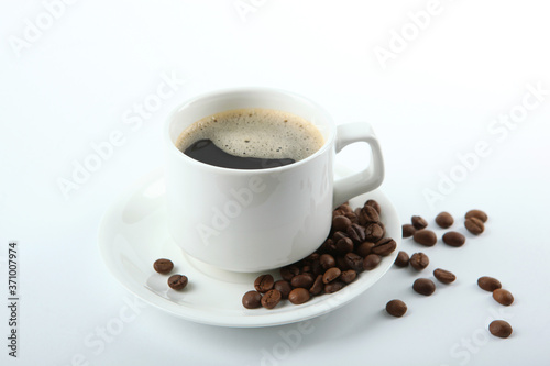 Fototapeta Naklejka Na Ścianę i Meble -  coffee beans and coffee cup on colored background with place for text
