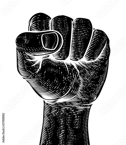 A fist in the air in a vintage woodcut revolution propaganda poster style