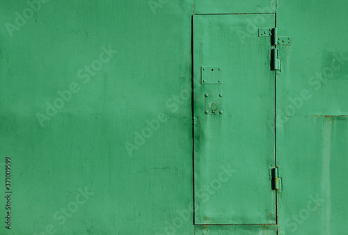 old wooden door with green paint © elizalebedewa