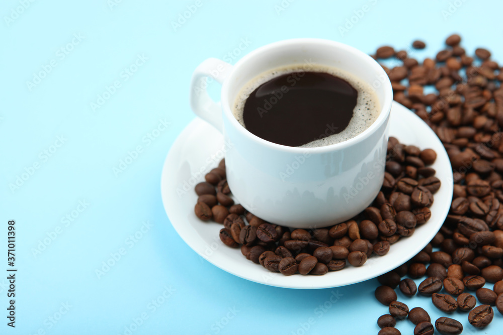 coffee beans and coffee cup on colored background with place for text
coffee beans and coffee cup on colored background with place for text