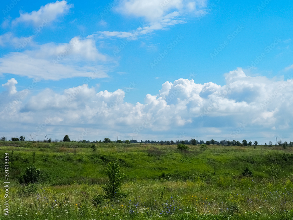 photo of a Russian large field above a cloudy sky