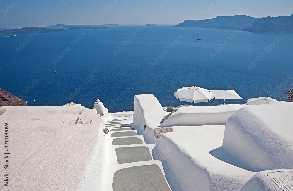 Fototapeta Panoramic view of caldera from Oia with rooftops of whitewashed houses, Santorini, Greece