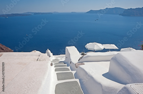 Panoramic view of caldera from Oia with rooftops of whitewashed houses, Santorini, Greece