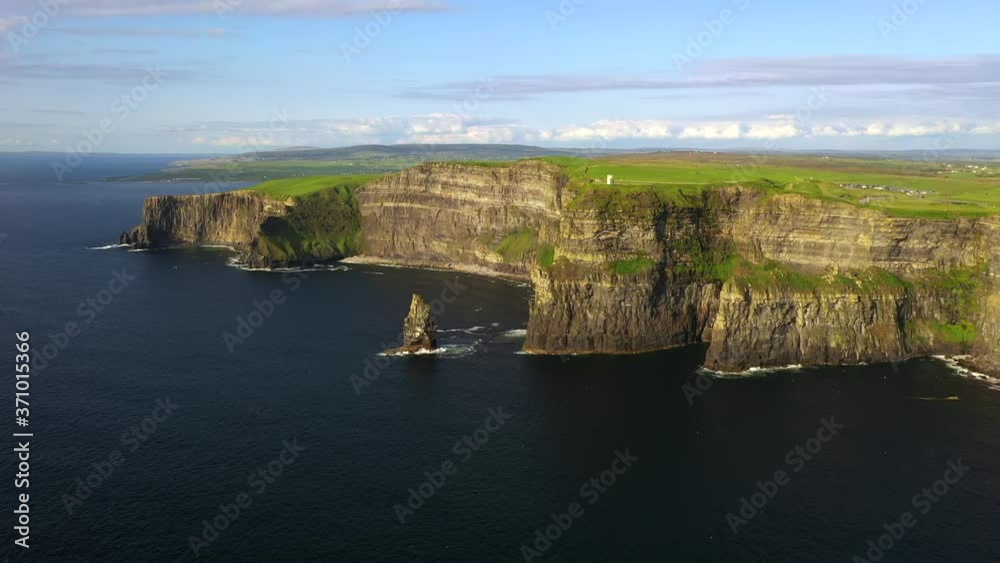 Cliffs of Moher, Clare, Ireland, August 2020, Drone gradually ascends revealing spectacular Northern Vista with Pinnacle Rock, O'Brien's Tower and Burren on the horizon. Cliffs of Moher, Clare, Ireland, August 2020, Drone gradually ascends revealing spectacular Northern Vista with Pinnacle Rock, O'Brien's Tower and Burren on the horizon.