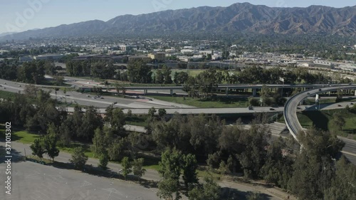 Aerial View of Golden State and Ventura Freeway in Suburbs of Los Angeles, California USA . Interchange and Overpass, Zoo Parking and John Ferraro Athletic Fields, Ascending Drone Shot photo