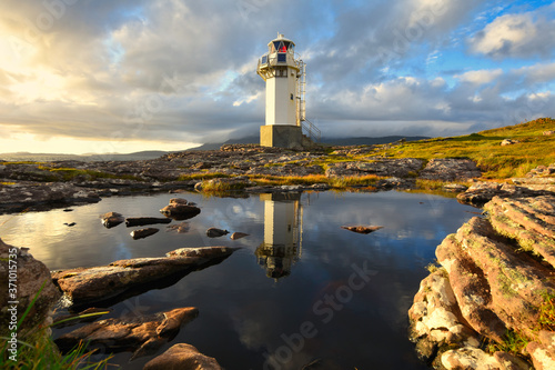 View of Rhue Lighthouse at sunset near Ullapool, North west scotland. photo