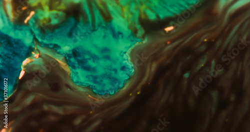 Macro Paint with Neon Color Palette. Oil Mixed with Bright Green and Yellow Dye and Paint.