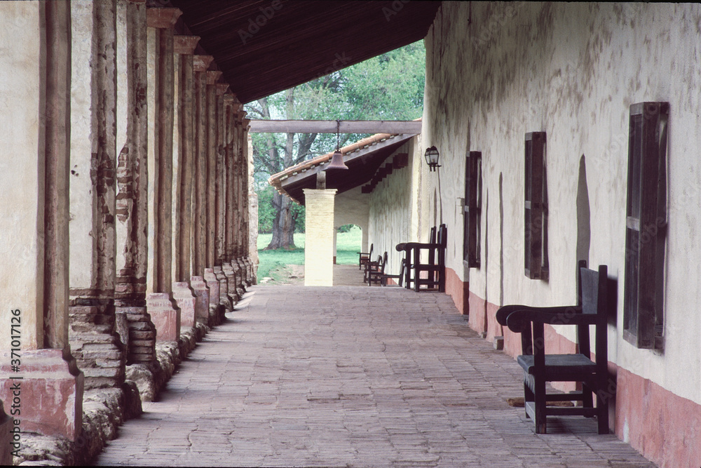 Fototapeta premium California Mission Hallway with chairs and columns