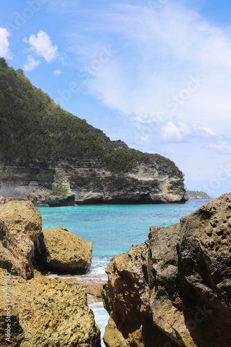 Suwehan beach on Nusa Penida Island, Bali, Indonesia. Amazing  view, white sand beach with rocky mountains and azure lagoon with clear water of Indian Ocean  © Yaroslav
