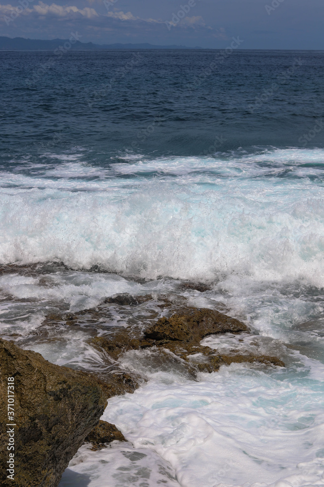 Suwehan beach on Nusa Penida Island, Bali, Indonesia. Amazing  view, white sand beach with rocky mountains and azure lagoon with clear water of Indian Ocean 