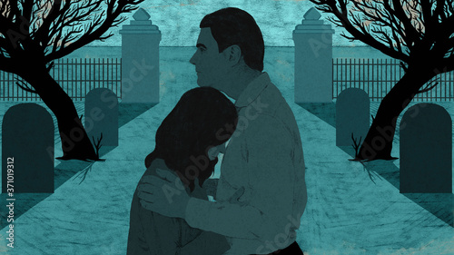 Grieving couple in cemetery
