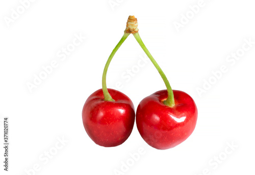 fresh cherry with green tail on white isolated background. Cherry