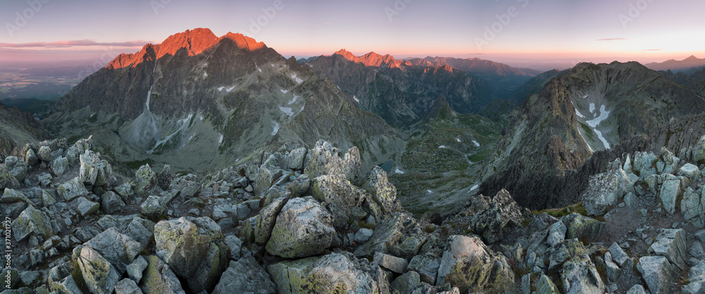 Obraz premium Sunset in High Tatras mountains national park in Slovakia. Scenic image of mountains. The sunrise over Carpathian mountains. Wonderful landscape. Picturesque view of nature. Amazing natural Background