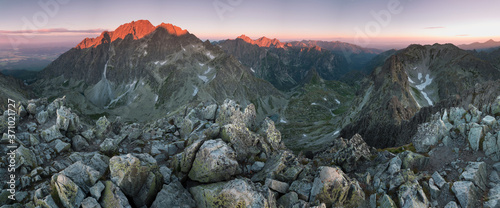 Sunset in High Tatras mountains national park in Slovakia. Scenic image of mountains. The sunrise over Carpathian mountains. Wonderful landscape. Picturesque view of nature. Amazing natural Background © Michal