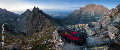 Summer bivi or bivouac in mountain alpine like landscape of High Tatras, Slovakia. Sunrise or sunset on the summit of peak.
million star hotel under night sky on pass in Alps. Beautiful nature 