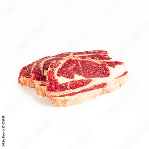 Matured beef chops, two fillets , photograph taken on pure white background, for e-commerce. front view