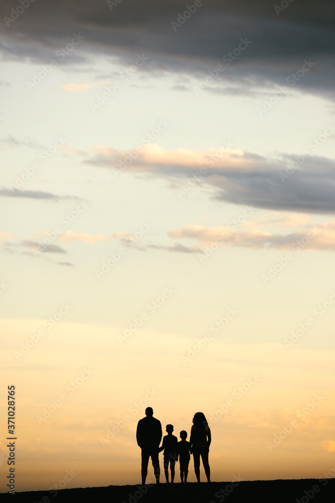 Silhouette of a Family on the beach Silhouette of a Family on the beach