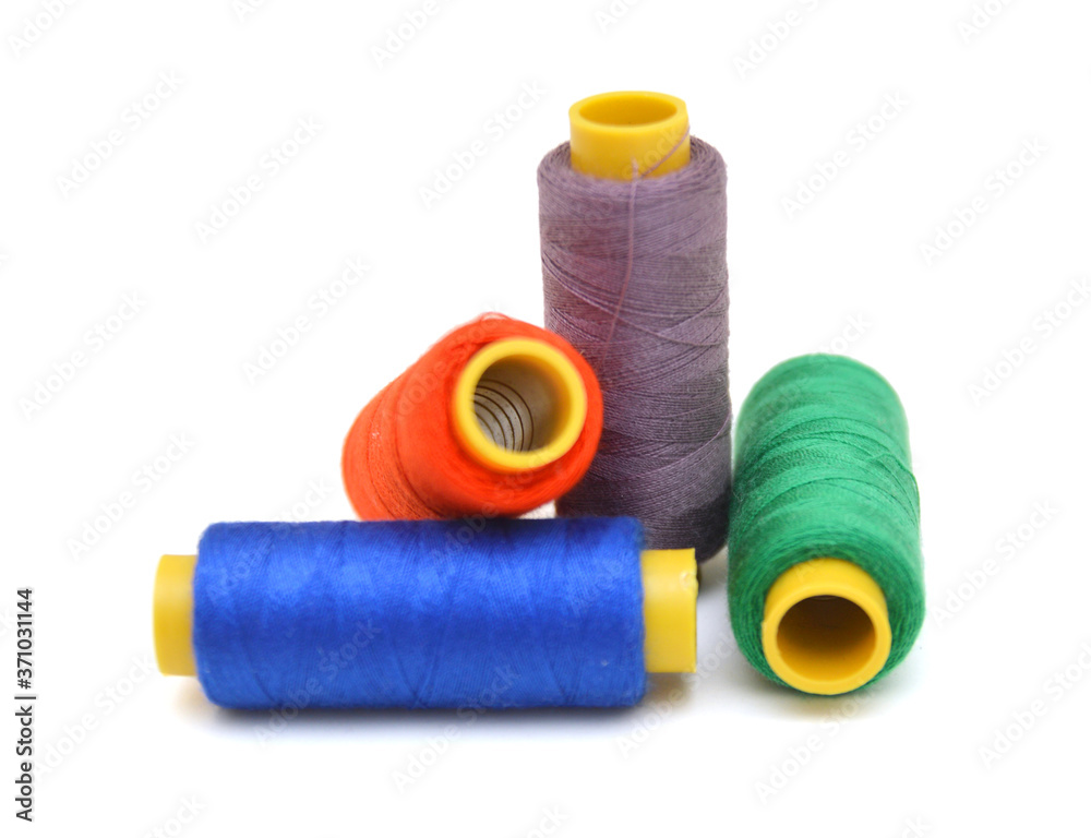 Spool of coloured thread isolated on white background. Spool of coloured thread isolated on white background.