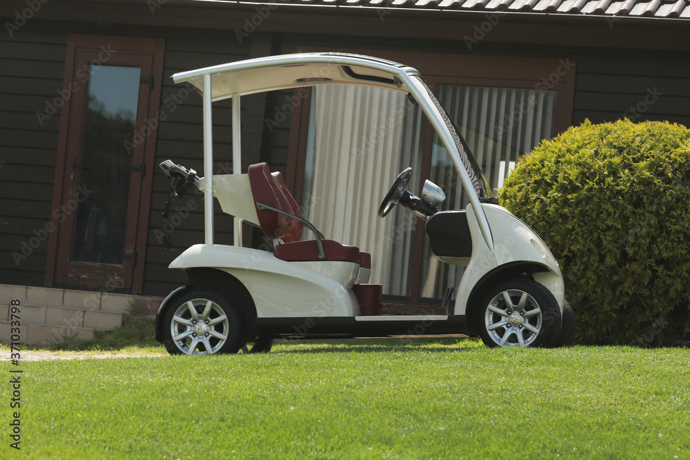 Golf car on the golf course.