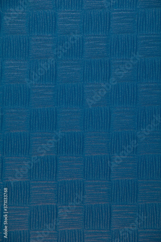 rough texture with a pattern of blue squares