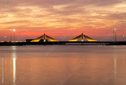 Fototapeta Naklejka Na Ścianę i Meble -  Sheikh Salman Causeway bridge with backdrop of dramatic sky, Bahrain
