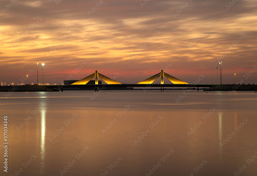 Sheikh Salman Causeway bridge during sunet with dramatic sky, Bahrain