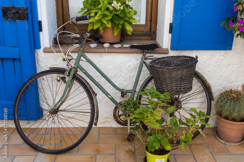 House with bicycle at the door in a Mediterranean village near Barcelona. Montgat photo