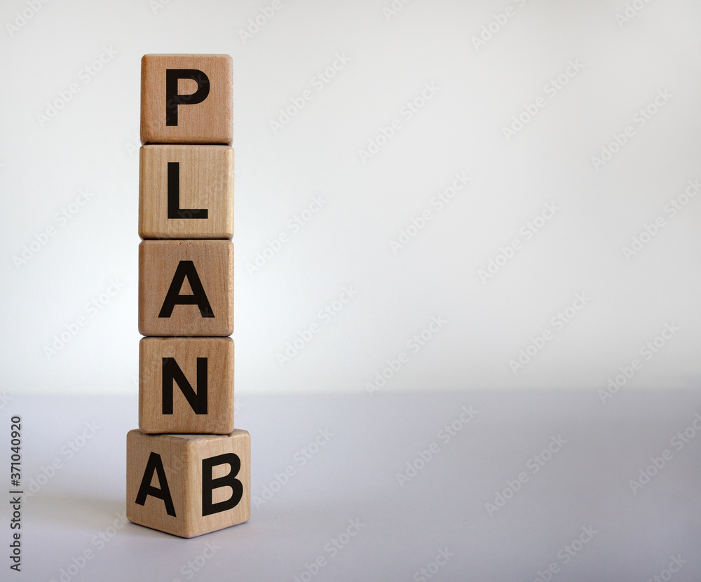 Time for Plan B. Turned cube and changing the word 'Plan A' to 'Plan B'. Beautiful white background. Business concept. Copy space. Time for Plan B. Turned cube and changing the word 'Plan A' to 'Plan B'. Beautiful white background. Business concept. Copy space.