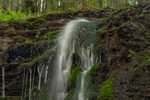 Waterfall near Kouty nad Desnou village in summer day