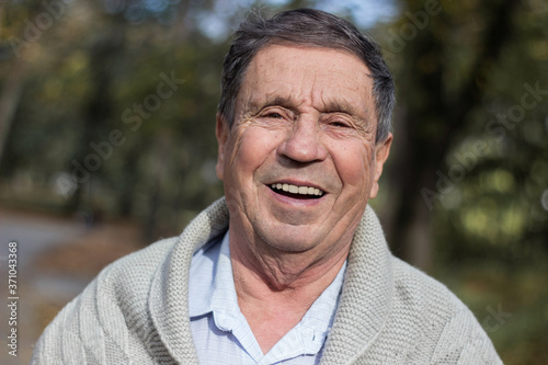 Portrait of happy senior man. Portrait of elderly man enjoying retirement