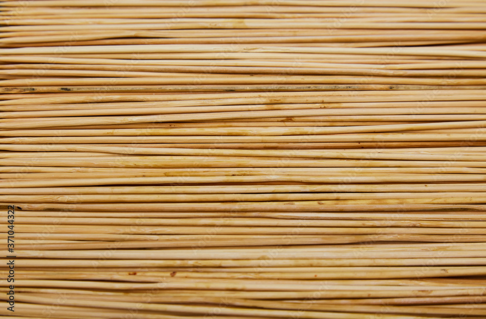 Texture horizontal new wooden skewers skewers for cooking. Thin pieces of light wood Texture horizontal new wooden skewers skewers for cooking. Thin pieces of light wood