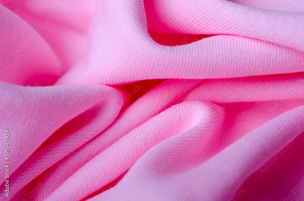 Pink cotton textile material cloth texture blur background Pink cotton textile material cloth texture blur background