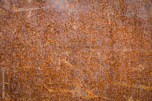 Texture of an iron plate all damaged with rust.