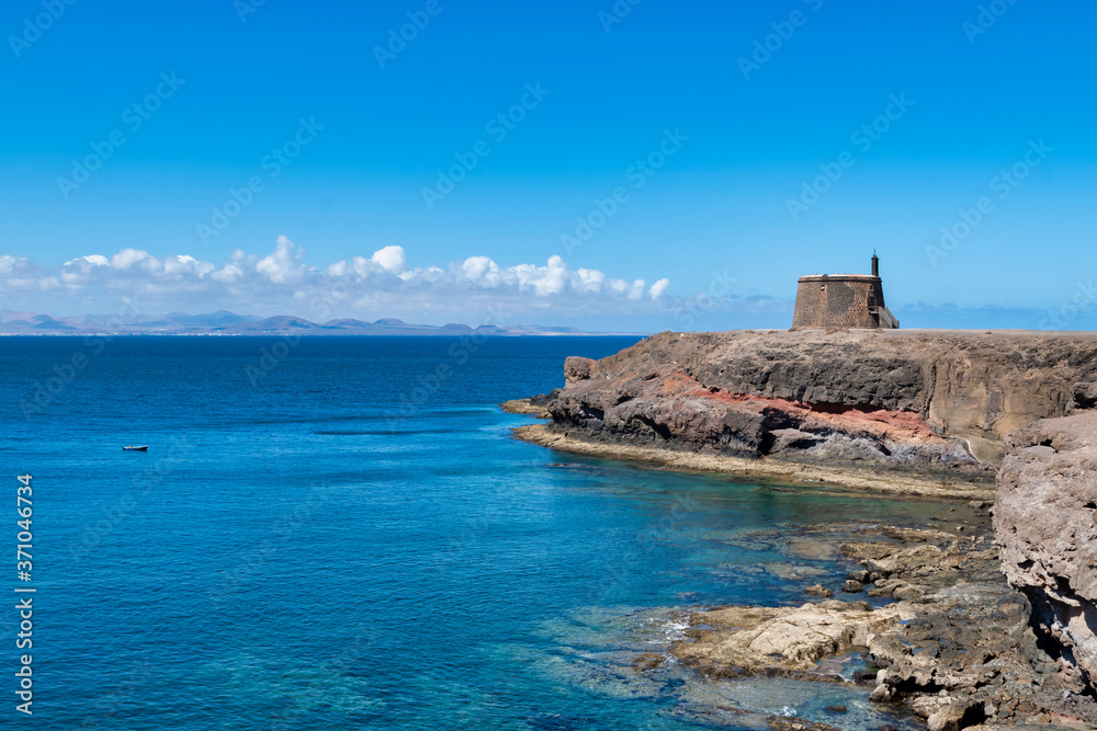 Castle Castillo de las Coloradas on cliff in Playa Blanca, Lanzarote, Canary Islands