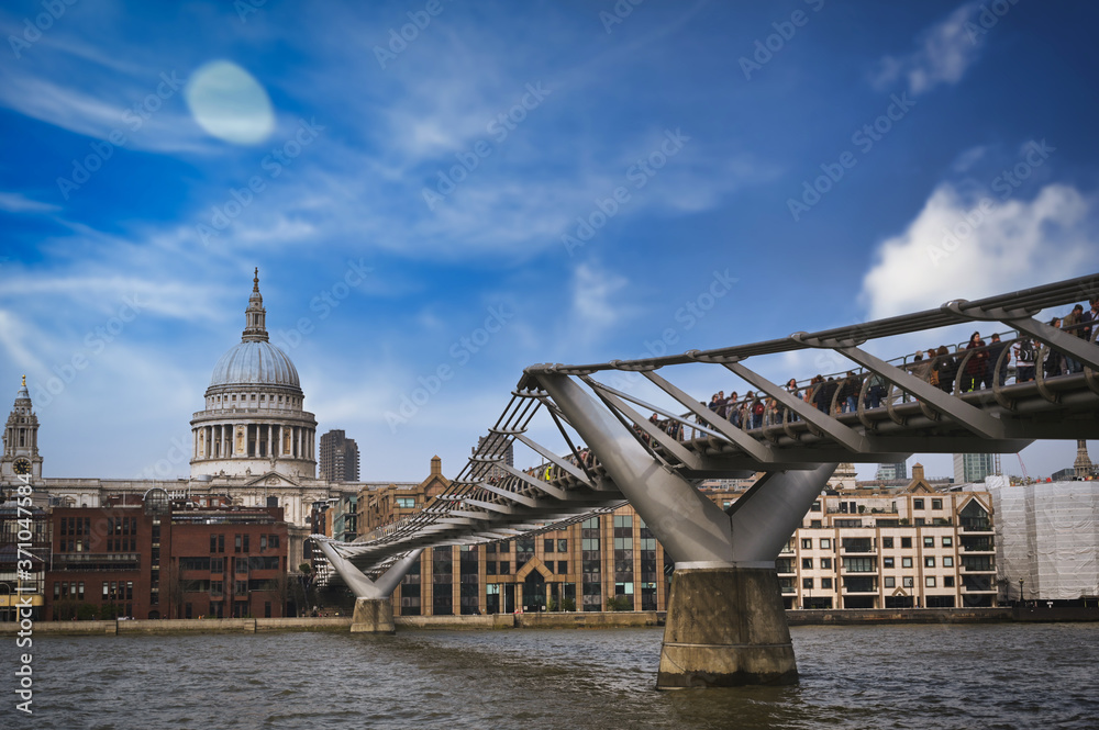 A view across the River Thames to St. Paul's Cathedral and the skyline of London, UK.