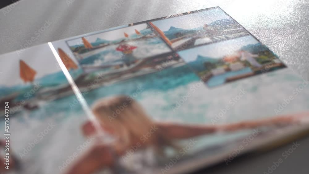 Turning photobook on the table at home Turning photobook on the table at home