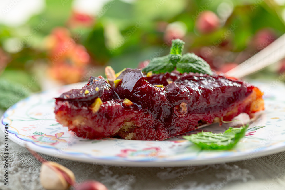 Piece of homemade Tarte Tatin with red plums. Piece of homemade Tarte Tatin with red plums.