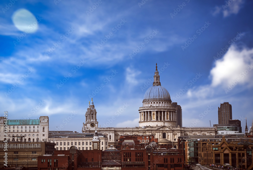 A view across the River Thames to St. Paul's Cathedral and the skyline of London, UK.