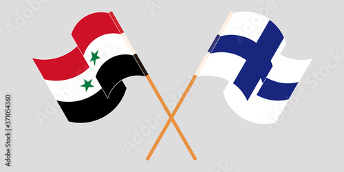 Crossed and waving flags of Syria and Finland