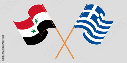 Crossed and waving flags of Syria and Greece