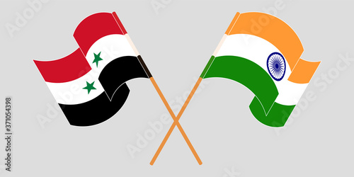 Crossed and waving flags of Syria and India
