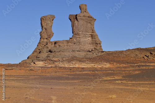 SAHARA DESERT IN ALGERIA. ERODED MOUNTAINS AND ROCK FORMATIONS IN TADRART NATIONAL PARK