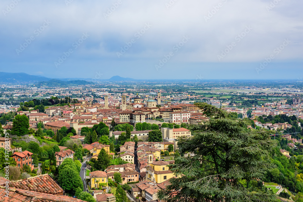 View of the city of Bergamo and its central historical part from the height of the observation deck of the castle of Di San Vigilio. Castle di San Vigilio is a public place