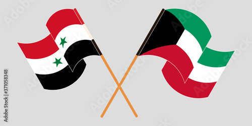 Crossed and waving flags of Syria and Kuwait