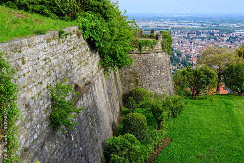 The castle walls of the castle of Di San Vigilio, view of the city of Bergamo. Castle di San Vigilio is a public place. Italy