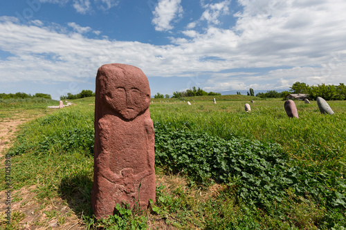 Balbans known as stone warriors, in the ruins of the ancient site of Balasagun known also as Burana Tower in Kyrgyzstan. photo