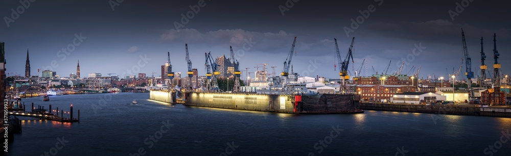 The port of Hamburg in the evening with Elbphilharmonie and Landungsbrücken